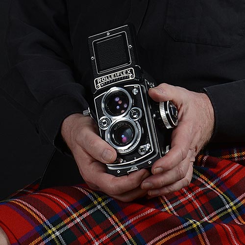 Kilt and a vintage Rolleiflex camera